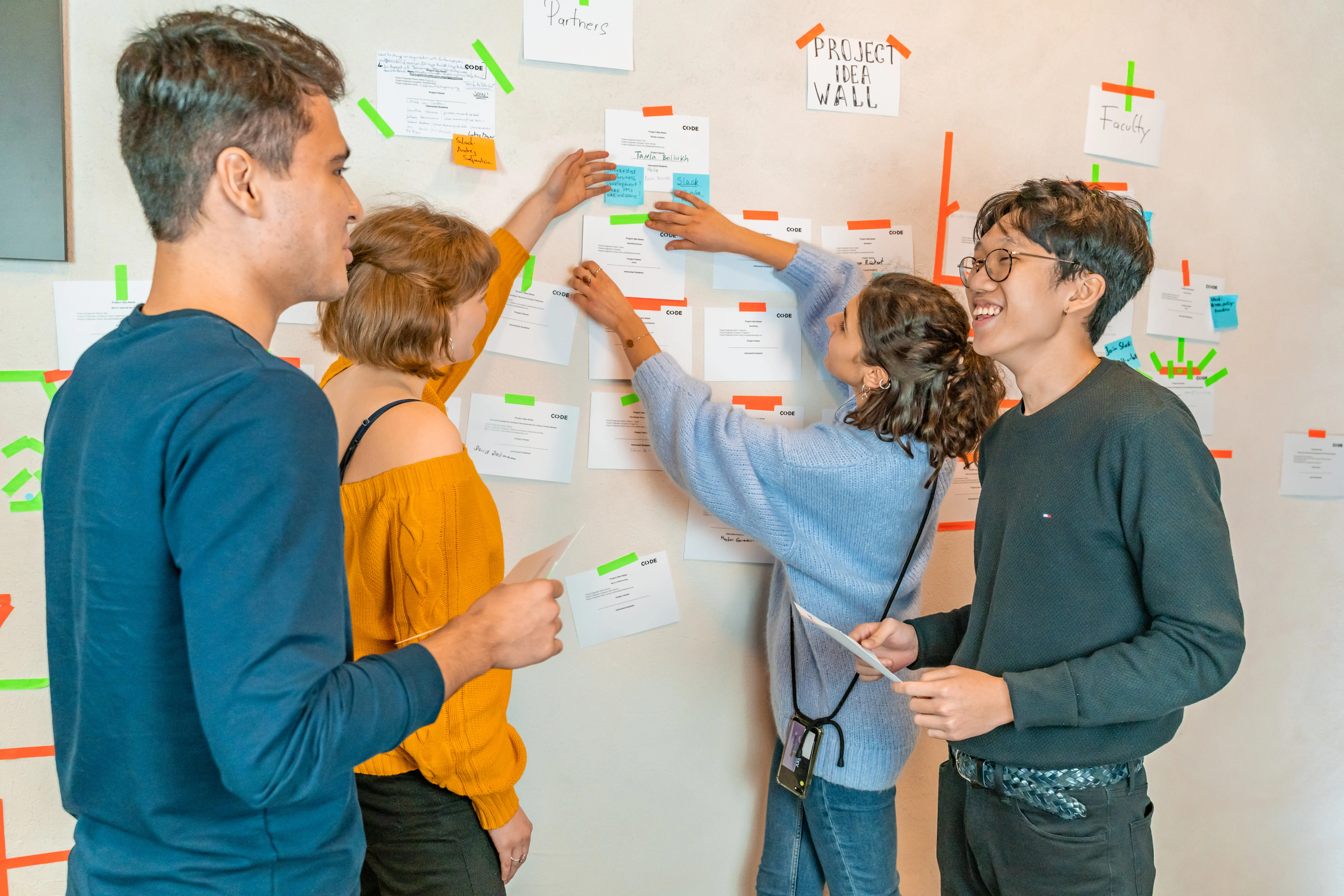 Students in front of a post-it wall