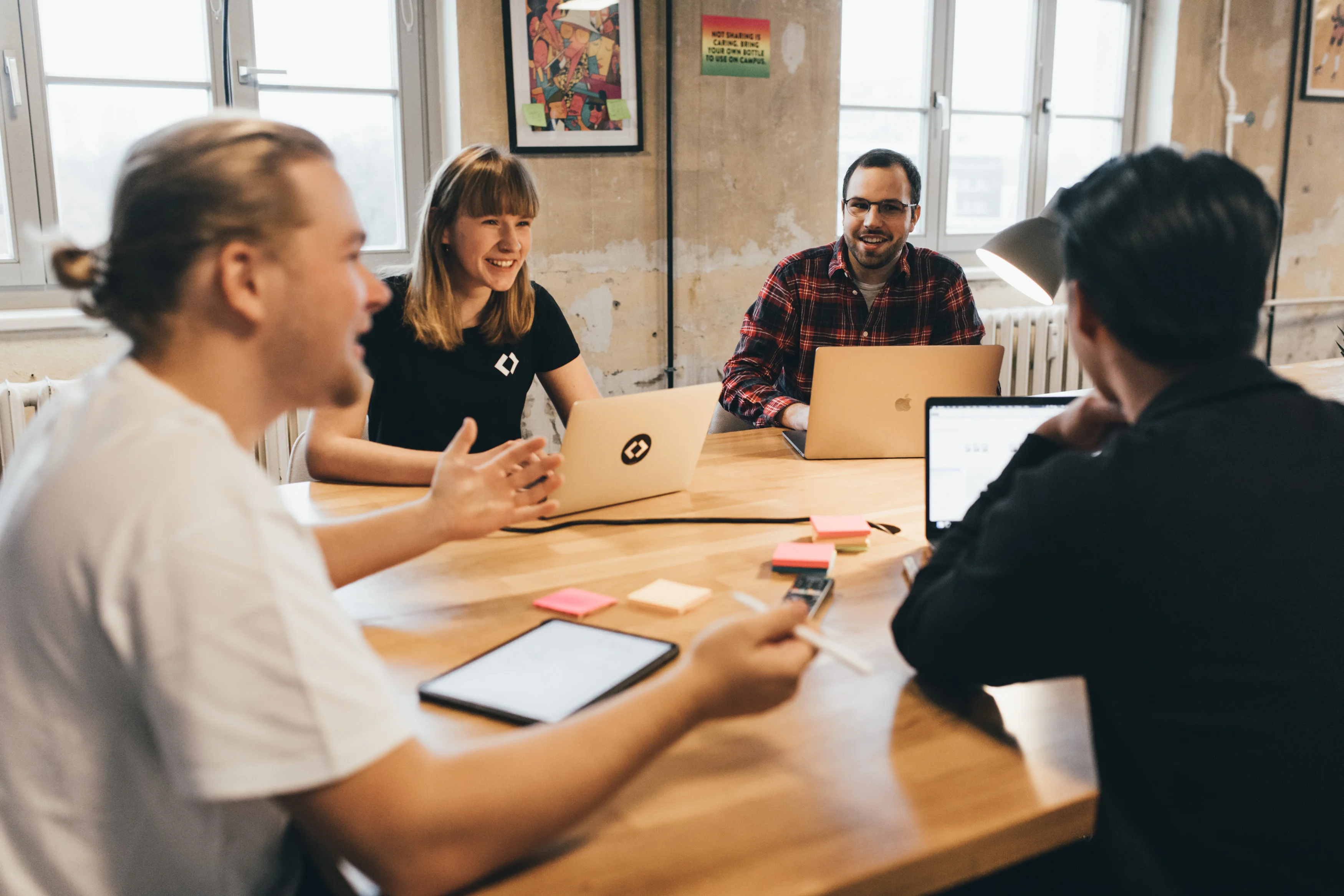 Group of students sitting at a table at CODE University of applied sciences