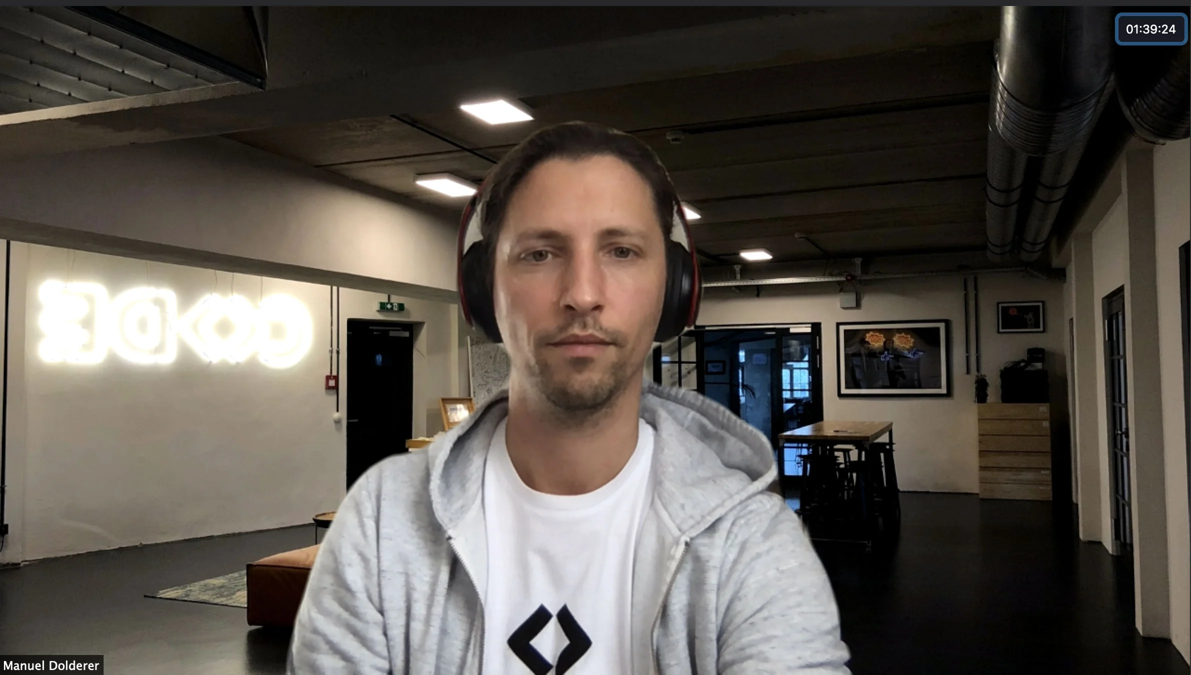 Our president Manuel with a virtual CODE campus background during a video call