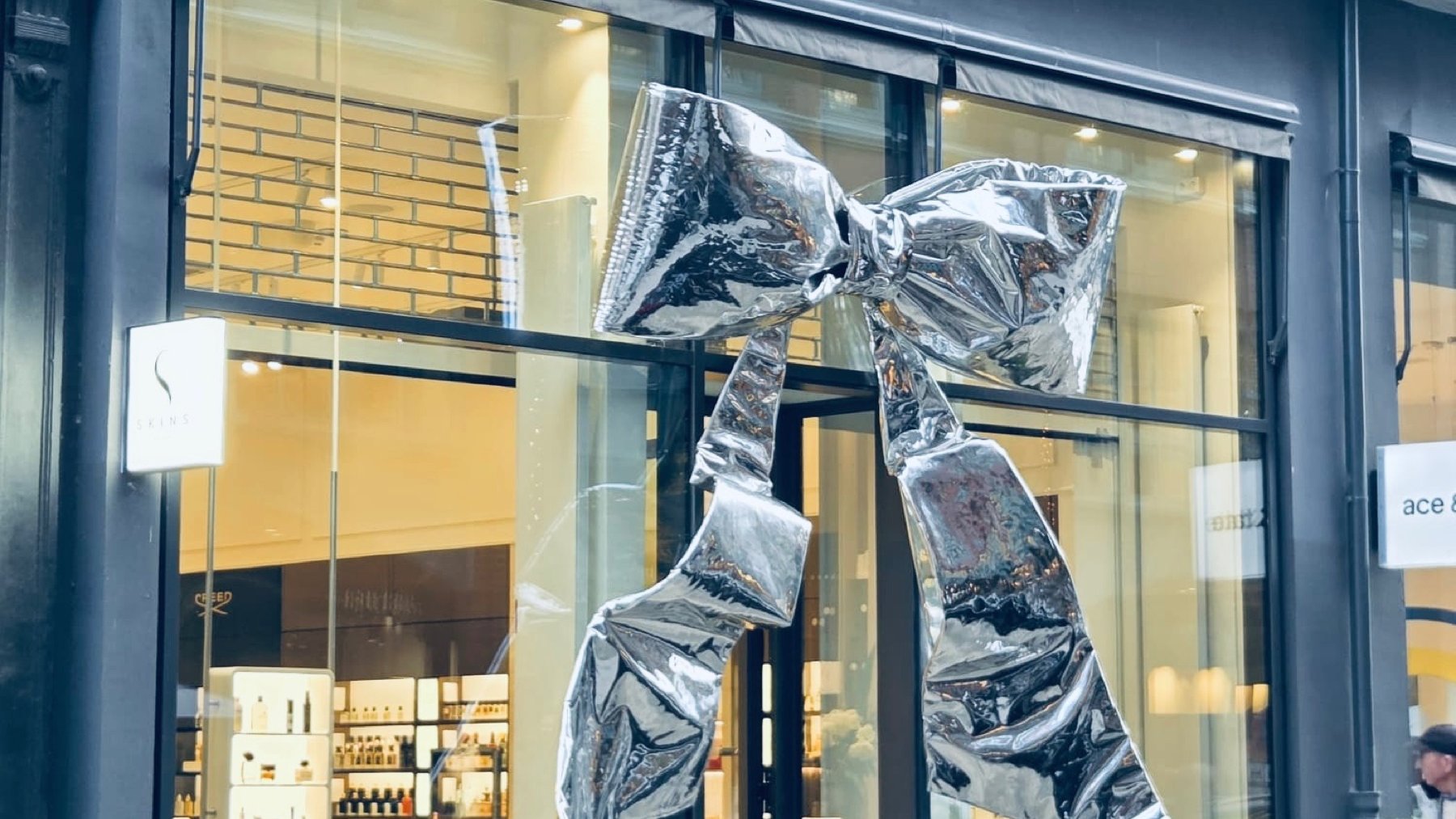 Silver bow on the Skins storefront