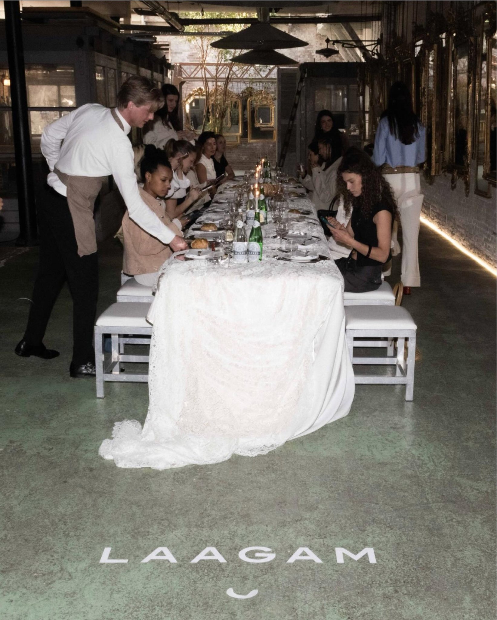 Laagam dinner table on white lace with mirror chargers