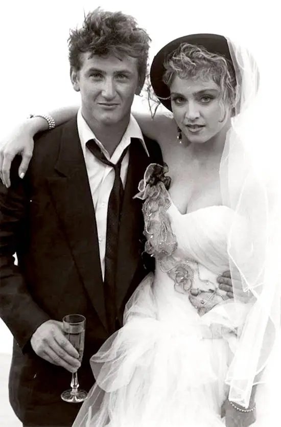 Black and white photo of Madonna and Sean Penn at their wedding.