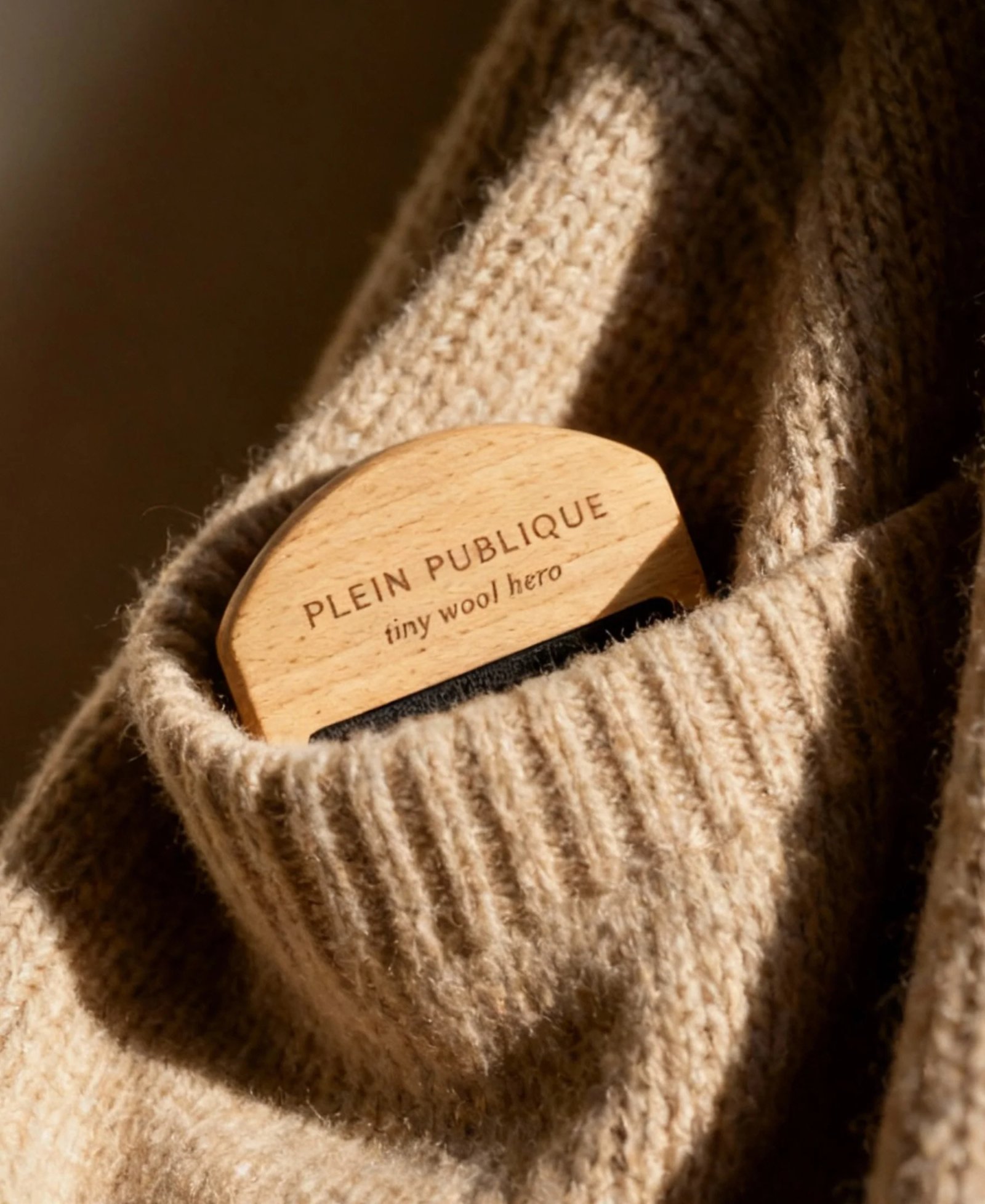 A wooden wool comb engraved with 
