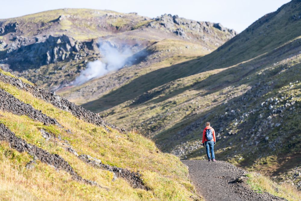 Hveragerdi Hot Springs road footpath with steam during autumn