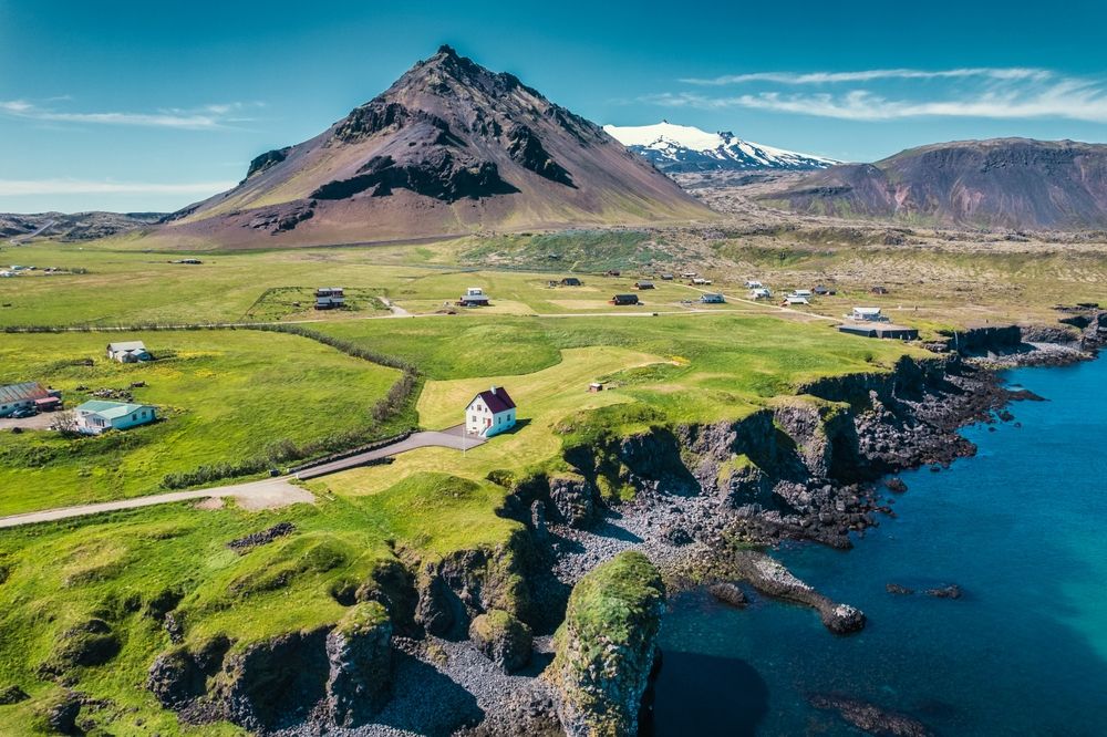 Beautiful aerial view of Arnarstapi fishing village with Stapafell volcanic mountain