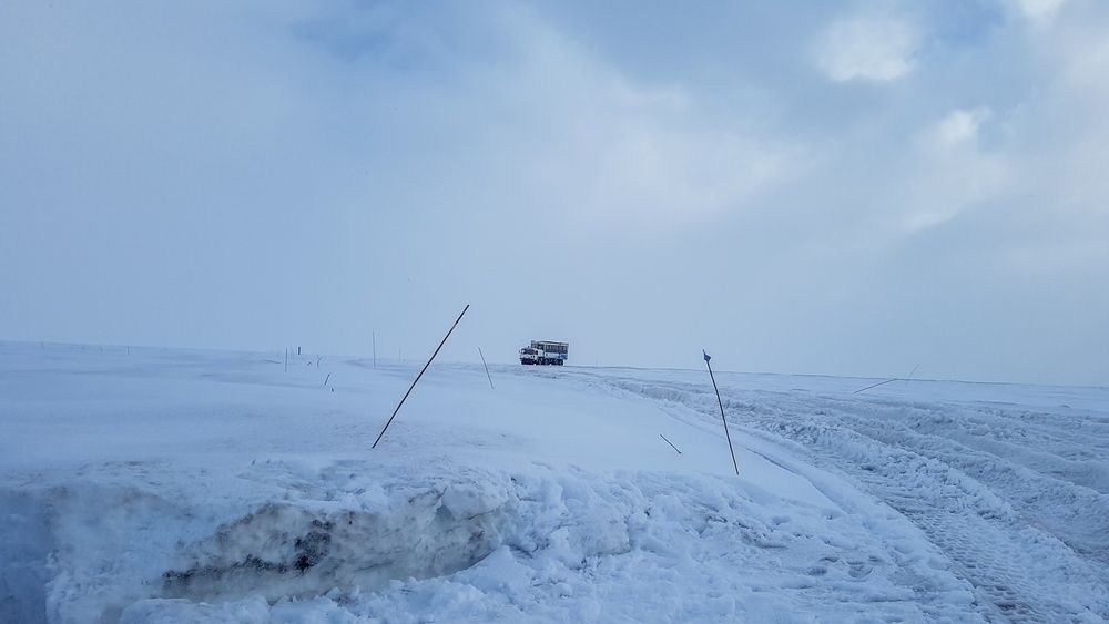 Large offroad truck driving ontop of Langjokull glacier in Iceland