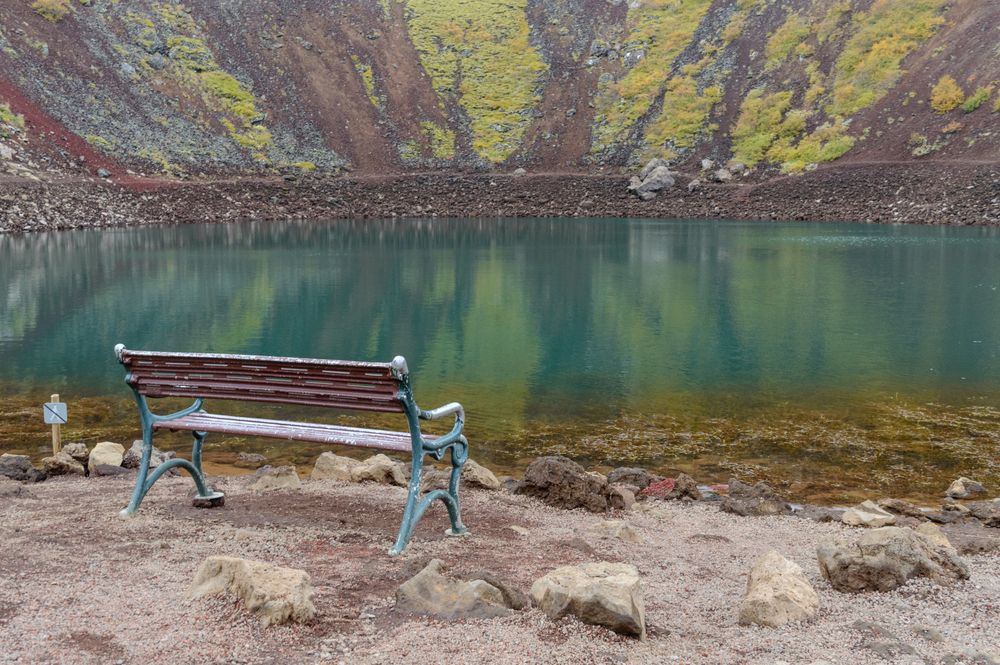 A closeup of a bench inside  the Kerid volcanic lake in Iceland