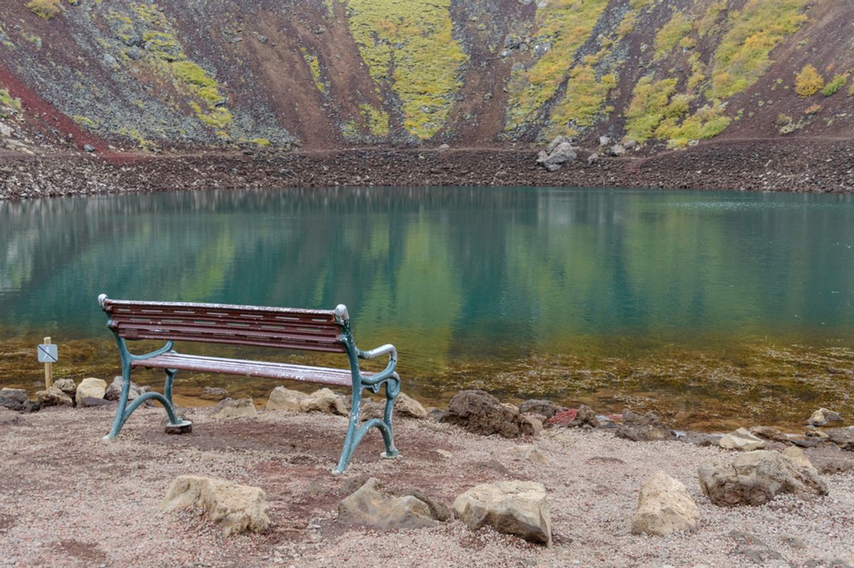 A closeup of a bench inside the Kerid volcanic lake in Iceland