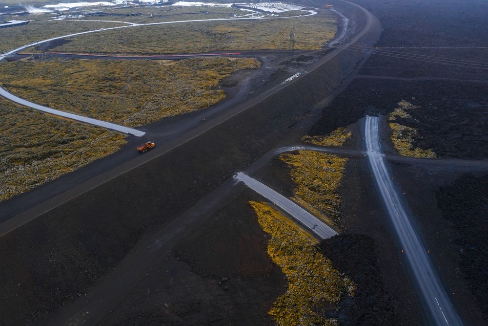 Dark lava fields intersect with winding roads