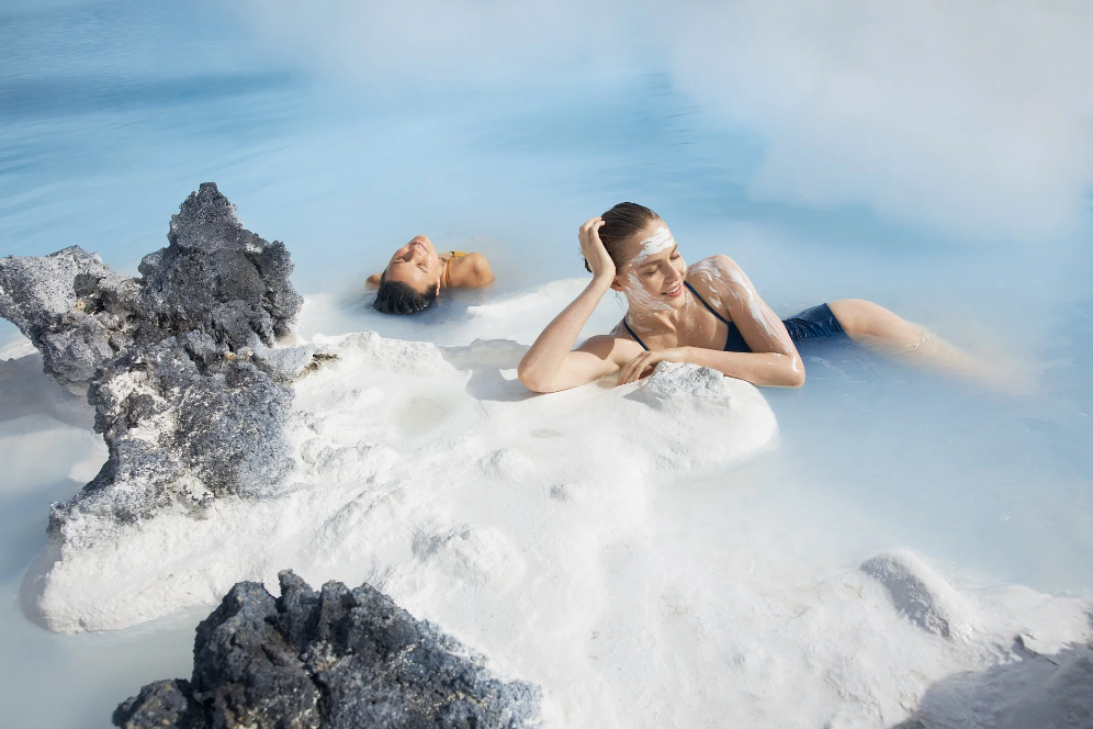 A woman relaxing in the silica-rich water at the Blue Lagoon