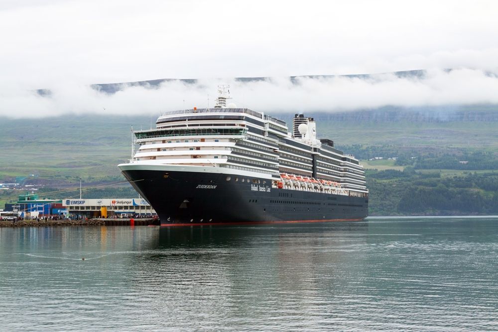 A cruise ship docked at a fjord port in Iceland