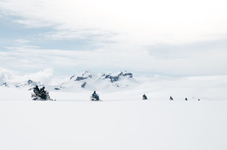 Riders on snowmobiles crossing Langjökull in a line