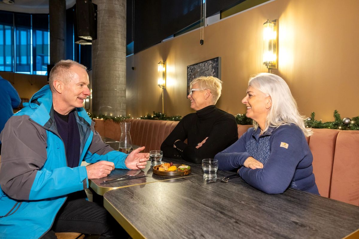 Diners seated at a table during dinner in a Reykjavik restaurant
