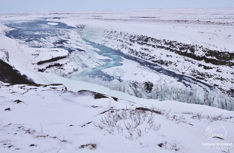 Gullfoss partly frozen in winter with ice on the canyon walls