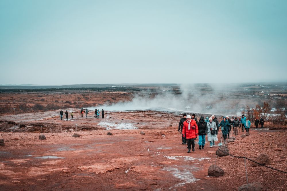 Steam rising across a geothermal field
