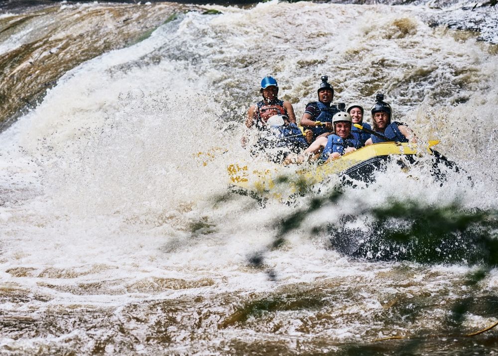 Rafters paddling through the basalt-walled Brúarhlöð canyon on the Hvítá river