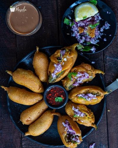Mirchi bajji served with onions