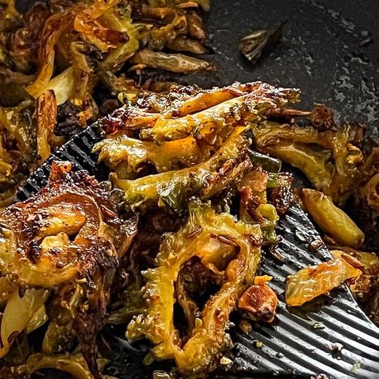 Crispy Bitter gourd fry straight from pan.