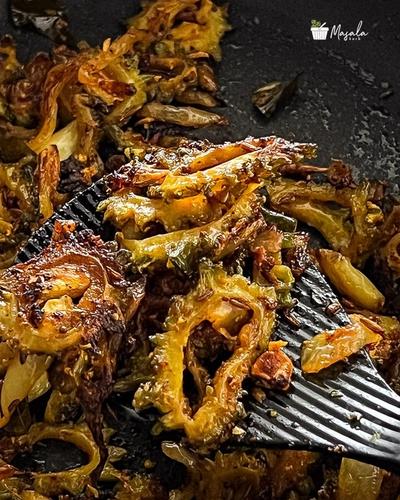 Crispy Bitter gourd fry straight from pan.
