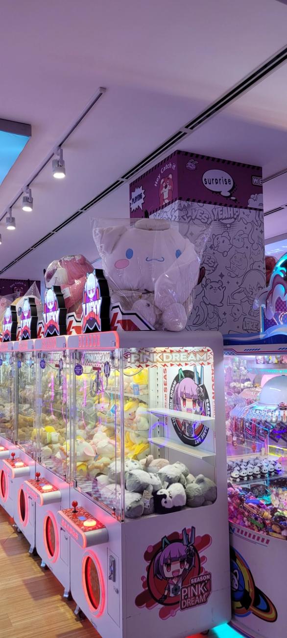 Colorful place with plushy toys and gaming machines