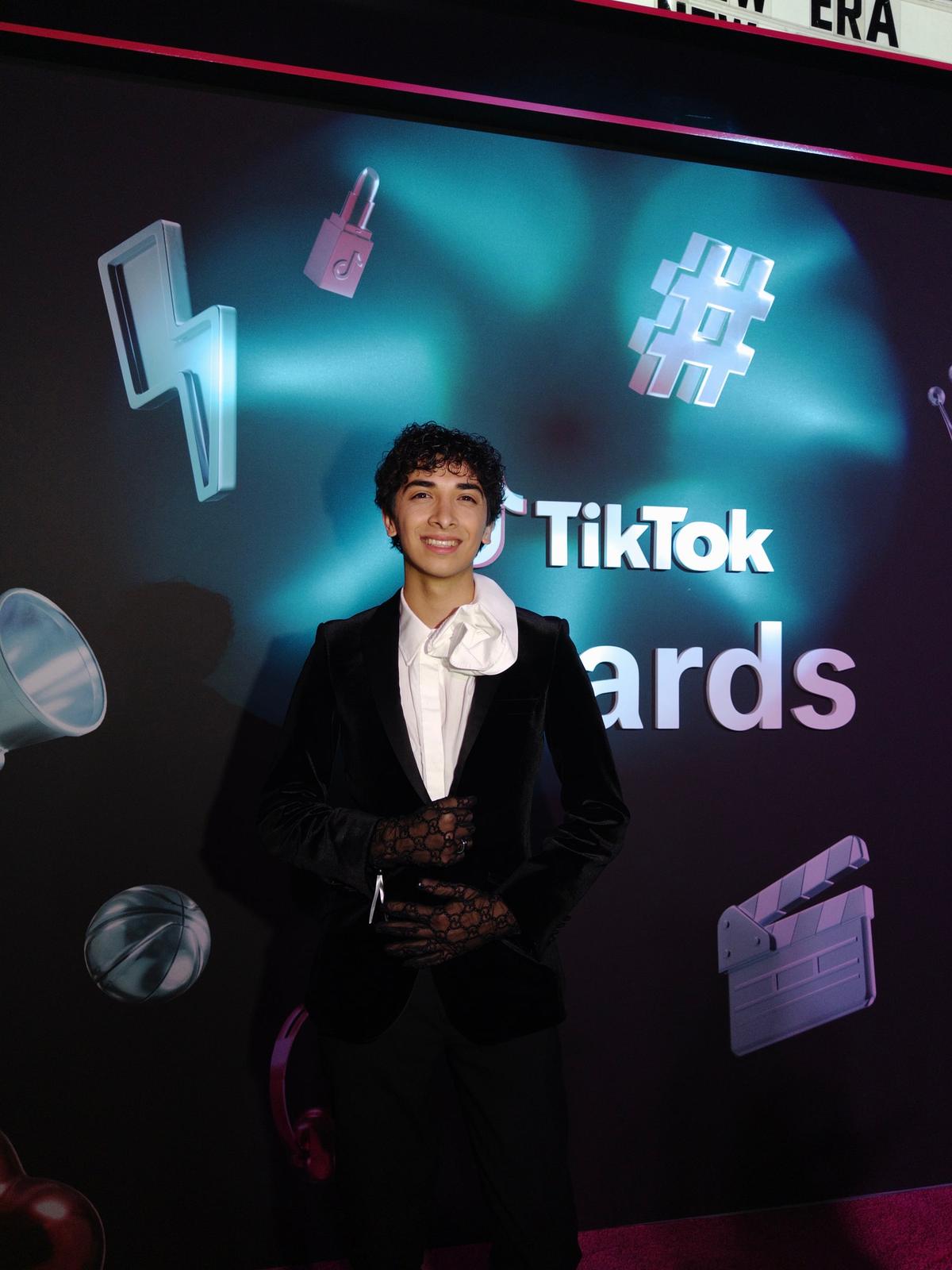 Joseph in a velvet suit and lace gloves at the TikTok Awards
