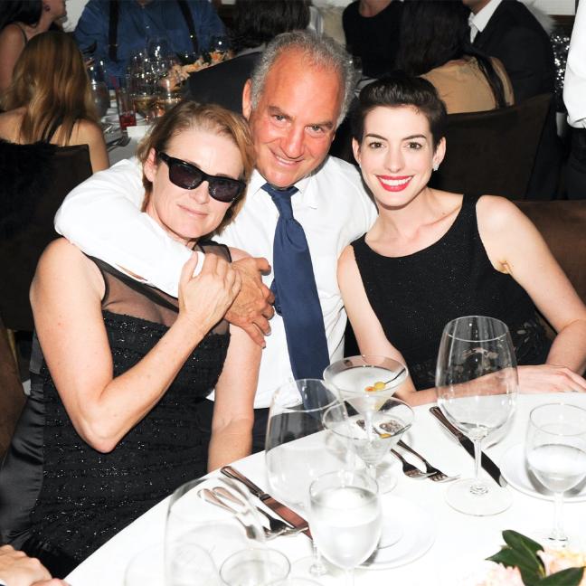 Charles Finch with Lisa Love and Anne Hathaway at the Chanel and Charles Finch Pre-Oscar dinner 2014