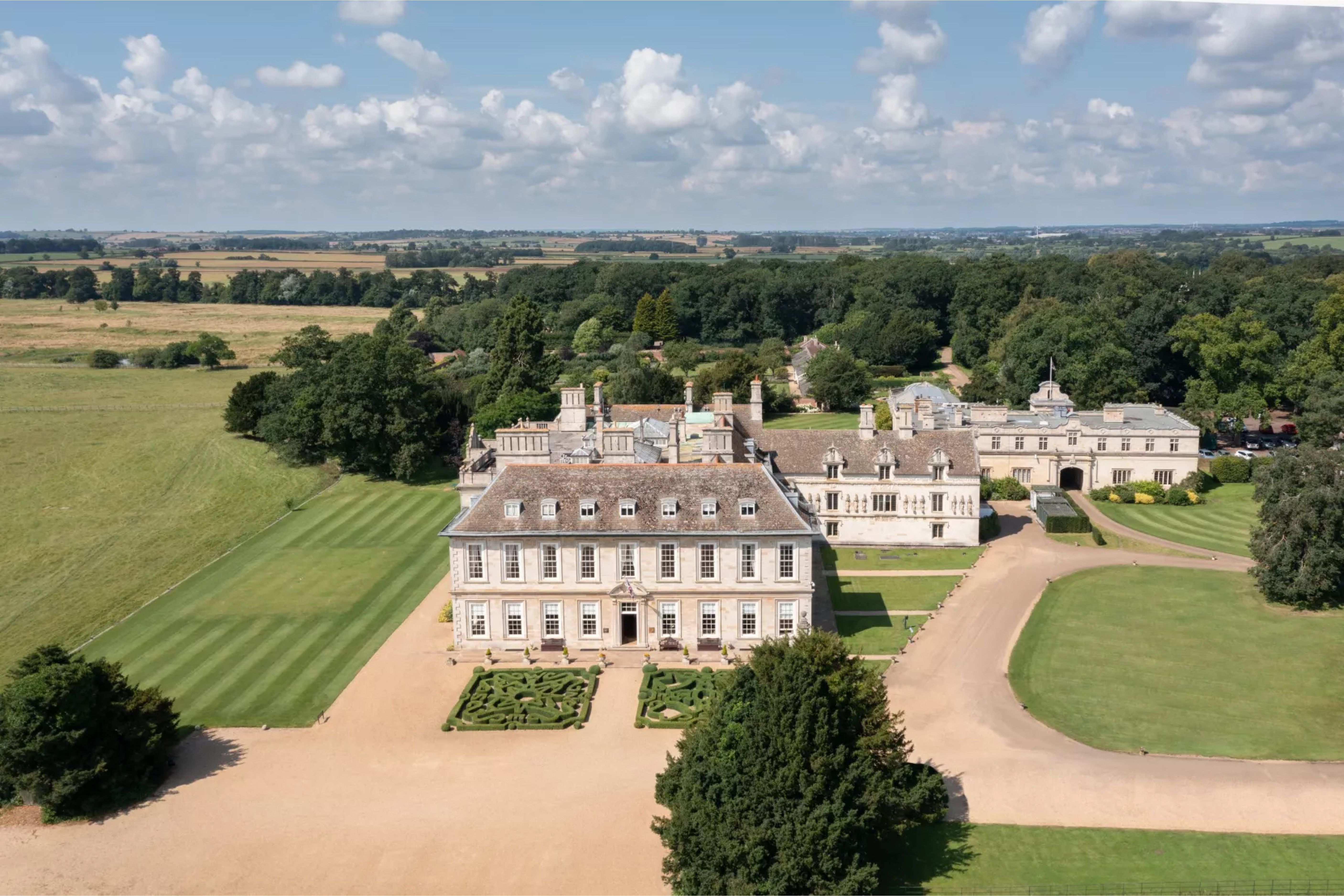Stapleford Park Hall and sweeping drive seen from above