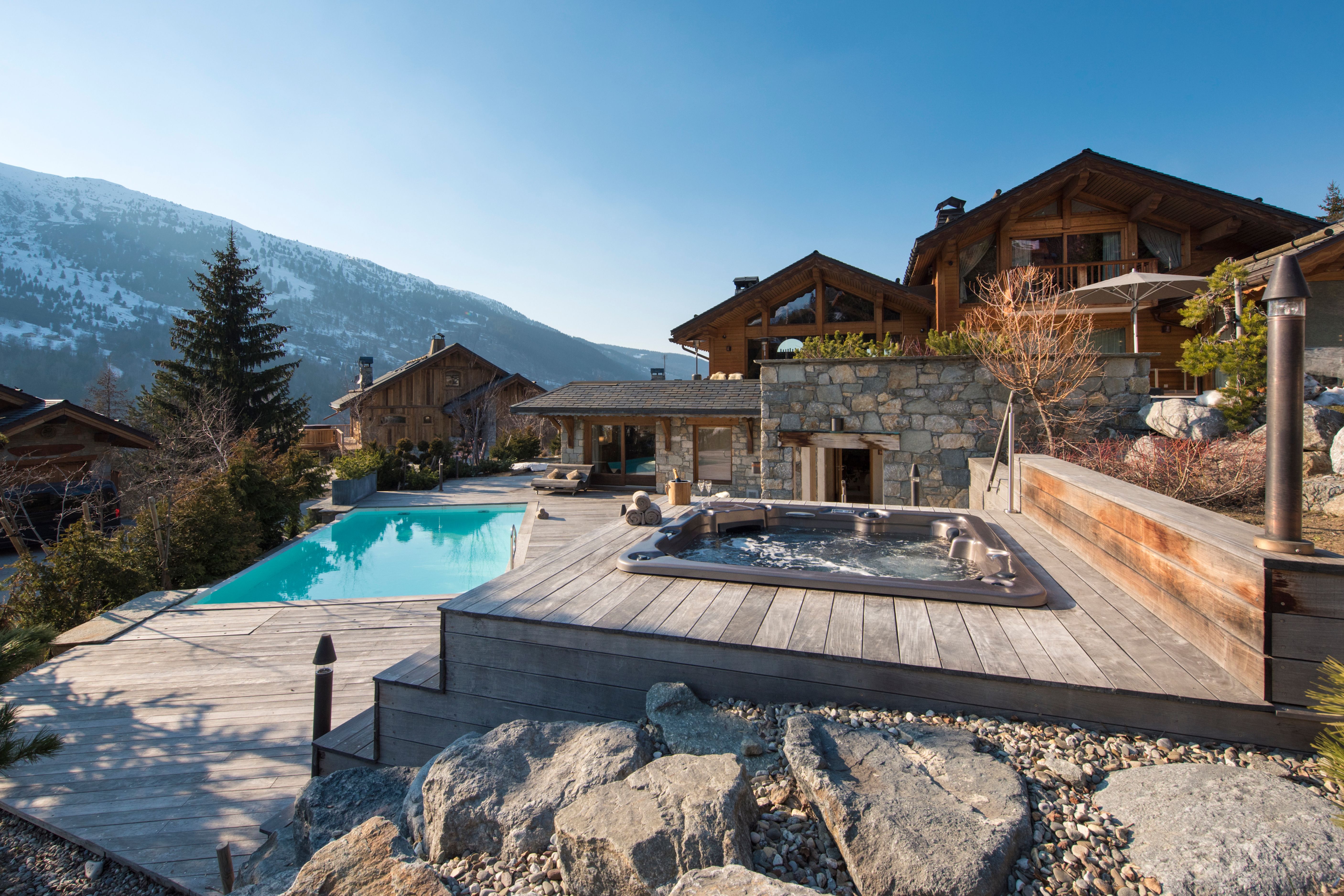 Outdoor pool and terrace at Chalet Mont Tremblant