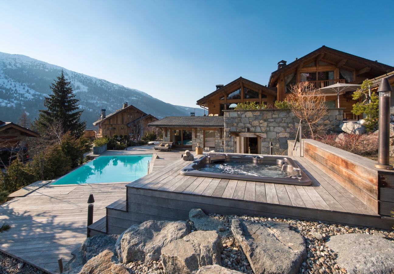 Outdoor pool and terrace at Chalet Mont Tremblant