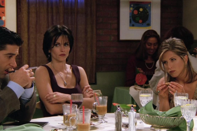 Characters from Friends discussing the bill at a restaurant