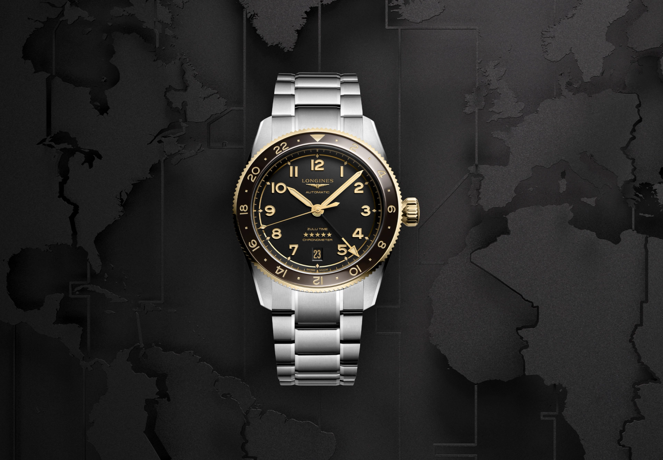 The front of a Longines Spirit Zulu Time watch with a blackened map of the world as a background