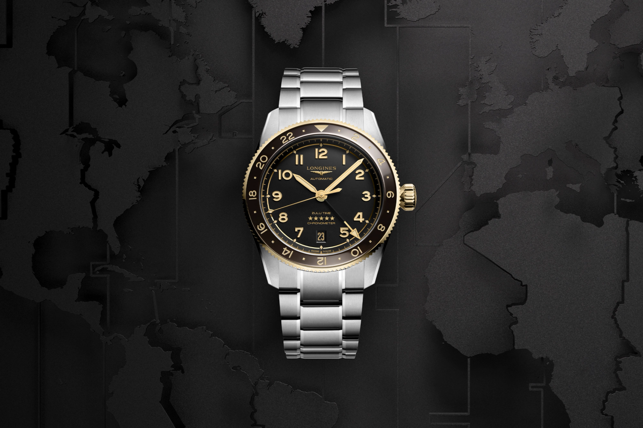 The front of a Longines Spirit Zulu Time watch with a blackened map of the world as a background