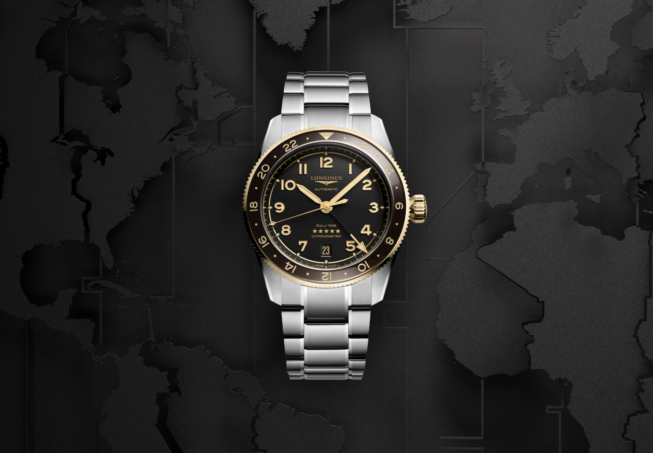 The front of a Longines Spirit Zulu Time watch with a blackened map of the world as a background
