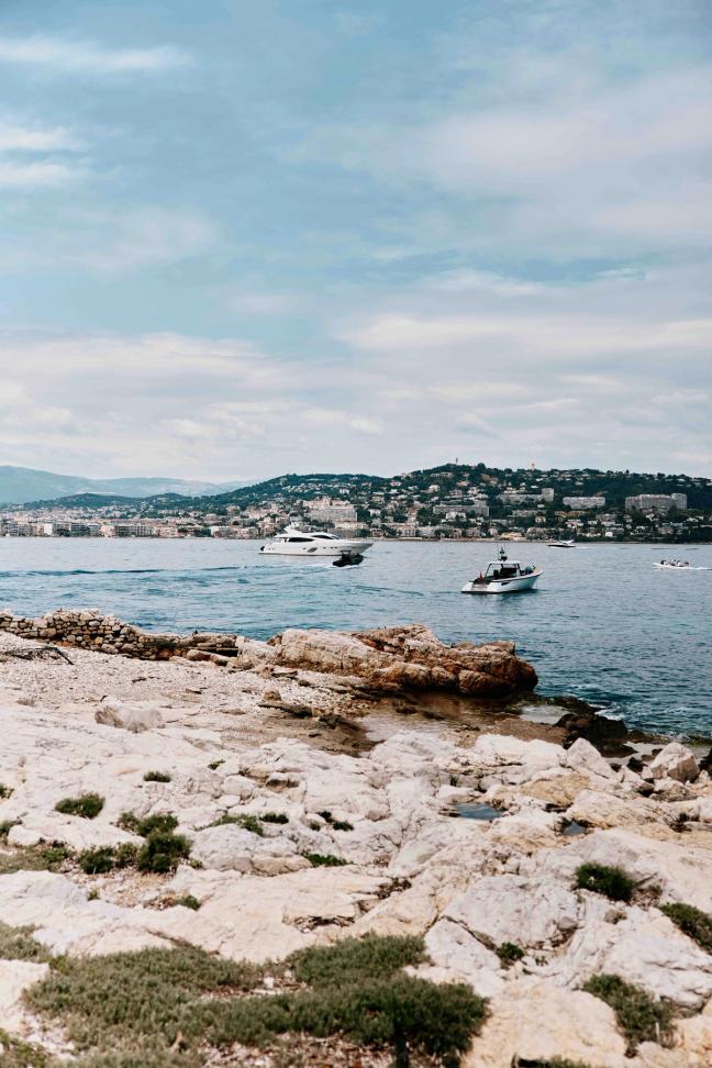 Boats sailing through the water along the Cannes sea front