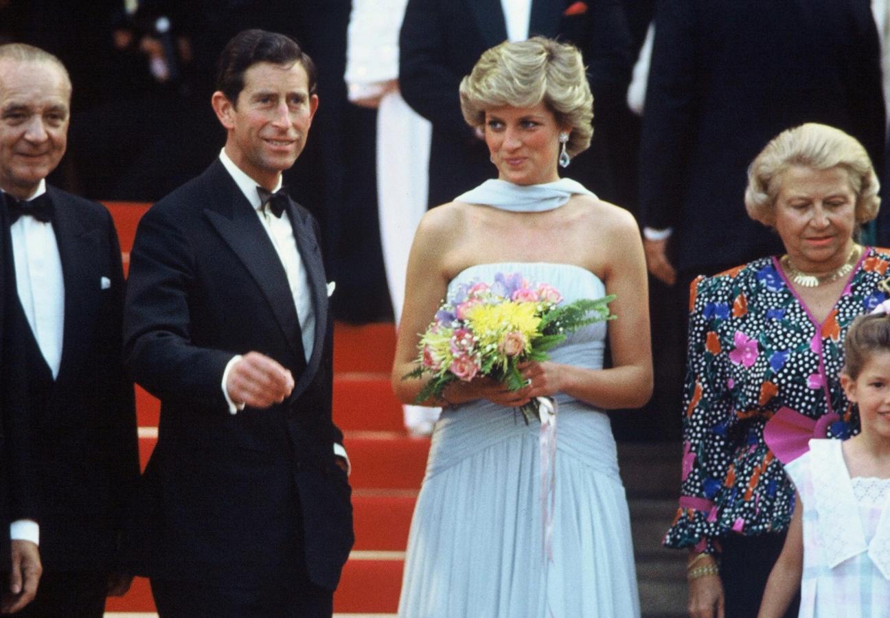 CANNES - MAY 15: Princess Diana, Princess of Wales, wearing a pale blue chiffon dress and matching stole by Catherine Walker, and Prince Charles, Prince of Wales attend Cannes film festival on May 15, 1987 in Cannes, France (Photo by Anwar Hussein/Getty Images)