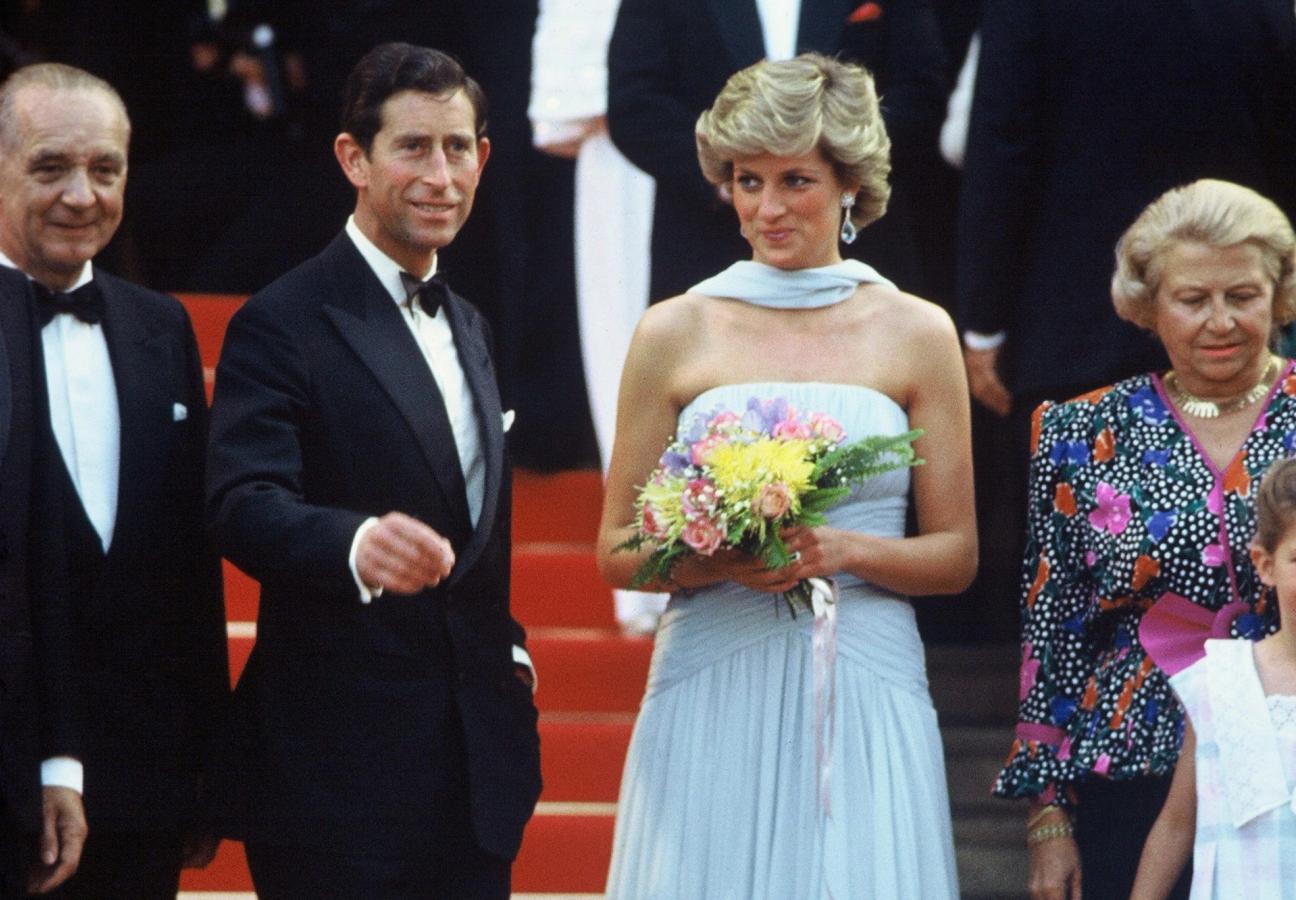 CANNES - MAY 15: Princess Diana, Princess of Wales, wearing a pale blue chiffon dress and matching stole by Catherine Walker, and Prince Charles, Prince of Wales attend Cannes film festival on May 15, 1987 in Cannes, France (Photo by Anwar Hussein/Getty Images)