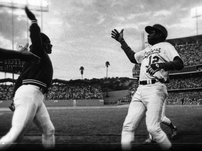 Los Angeles Dodgers players Glenn Burke and Dusty Baker pull off what some say is the first-ever high five, 1977