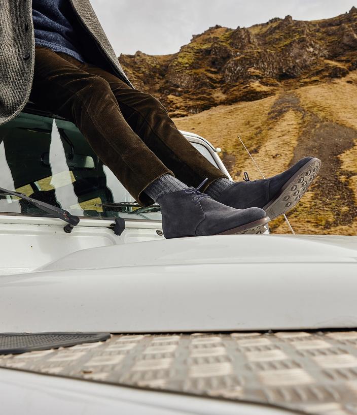 Man wearing Crockett & Jones’s Navy Suede chukka boot
