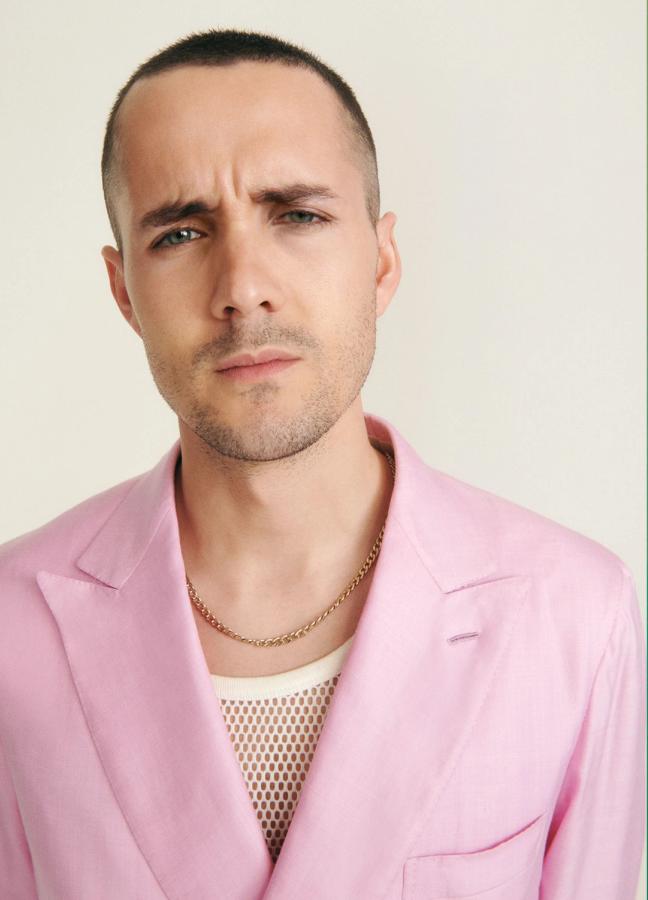 Jonah Hauer-King wearing a pink blazer over a white vest