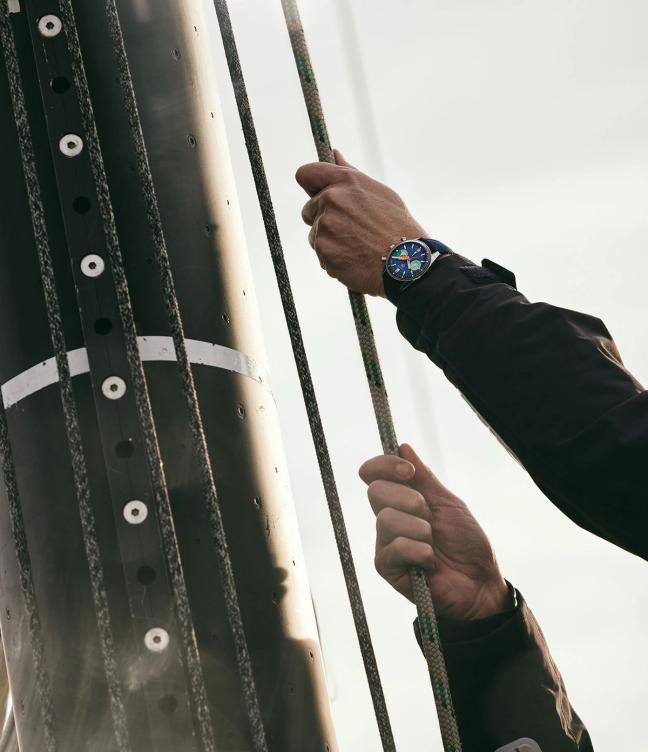 Man pulling rigging ropes waring TAG Heuer Carrera Skipper