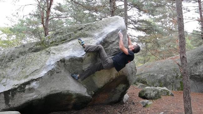 a man rock climbing in France