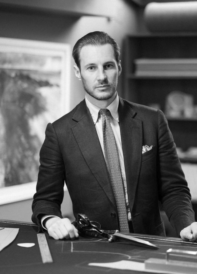 Black and White photo of Mike Deans, Head Cutter Tailoring Department at Oliver Brown wearing a suit