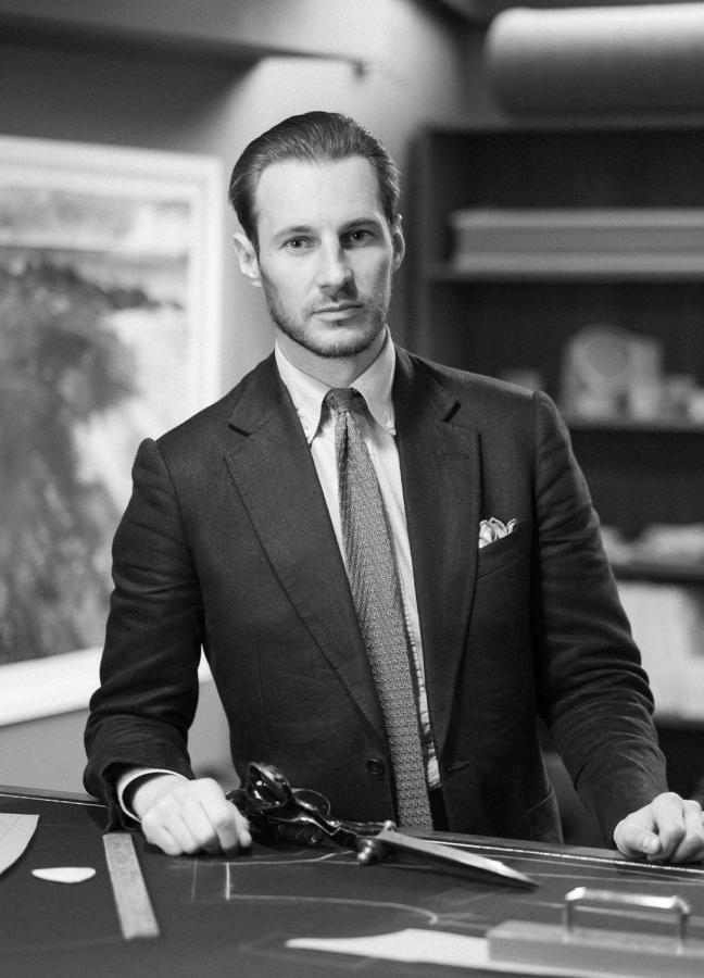 Black and White photo of Mike Deans, Head Cutter Tailoring Department at Oliver Brown wearing a suit