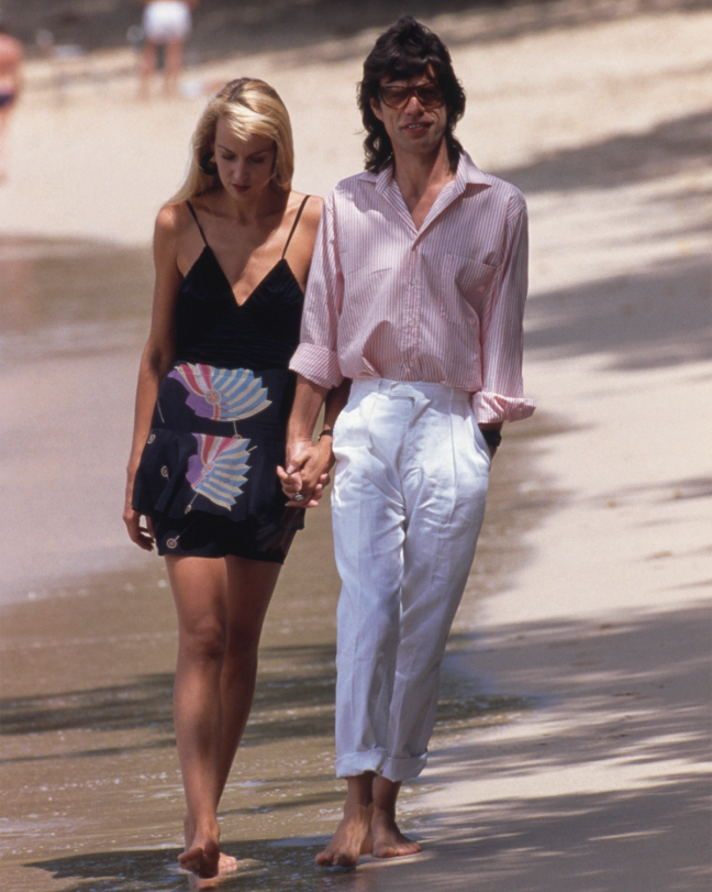 Mick Jagger and Jerry Hall on a beach in Mustique, February 18th 1987.