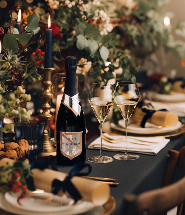 Bottle of 1086 by Nyetimber on a festive table