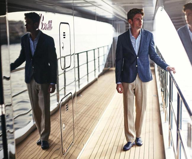 Gentleman's Journal Malta photoshoot, model wears navy linen blazer and beige linen trousers