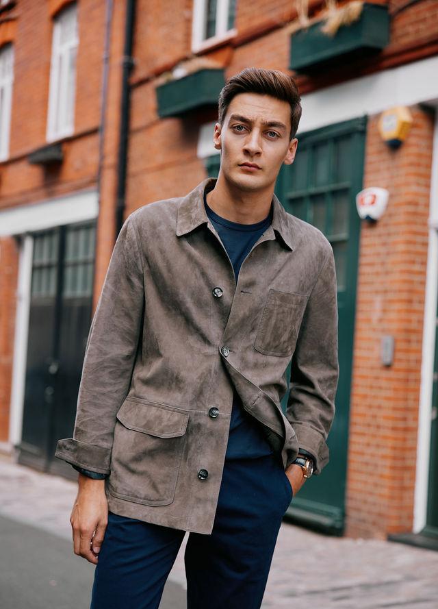 George Russell wears the IWC Portugieser Chronograph, Brioni Jacket, T-shirt by Sunspel, Trousers by Orlebar Brown and shoes by Tods