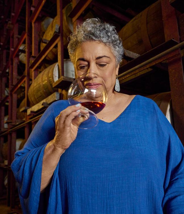 Joy Spence, master blender at Appleton Estate, smelling a glass of rum