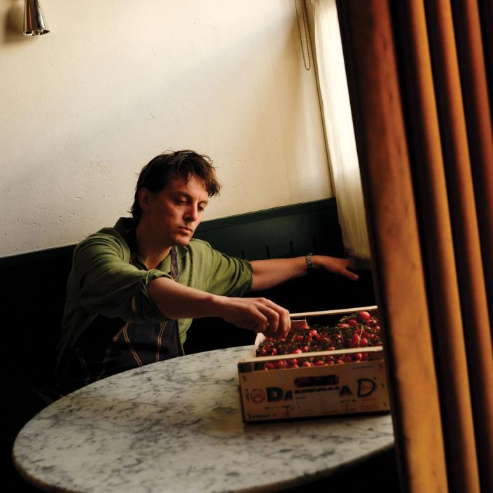 Tom Straker sampling tomatoes