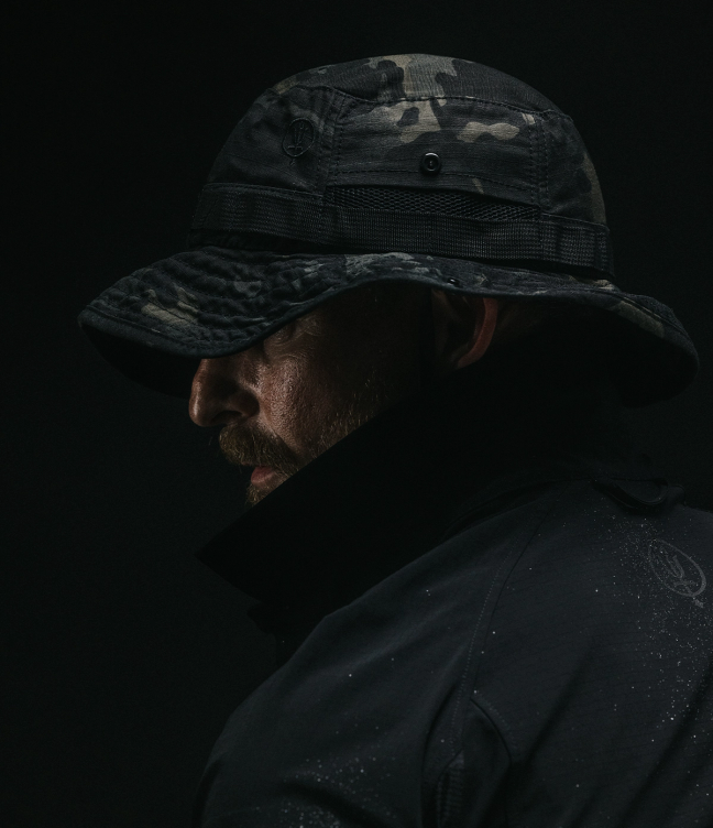 man wearing watchman boonie hat